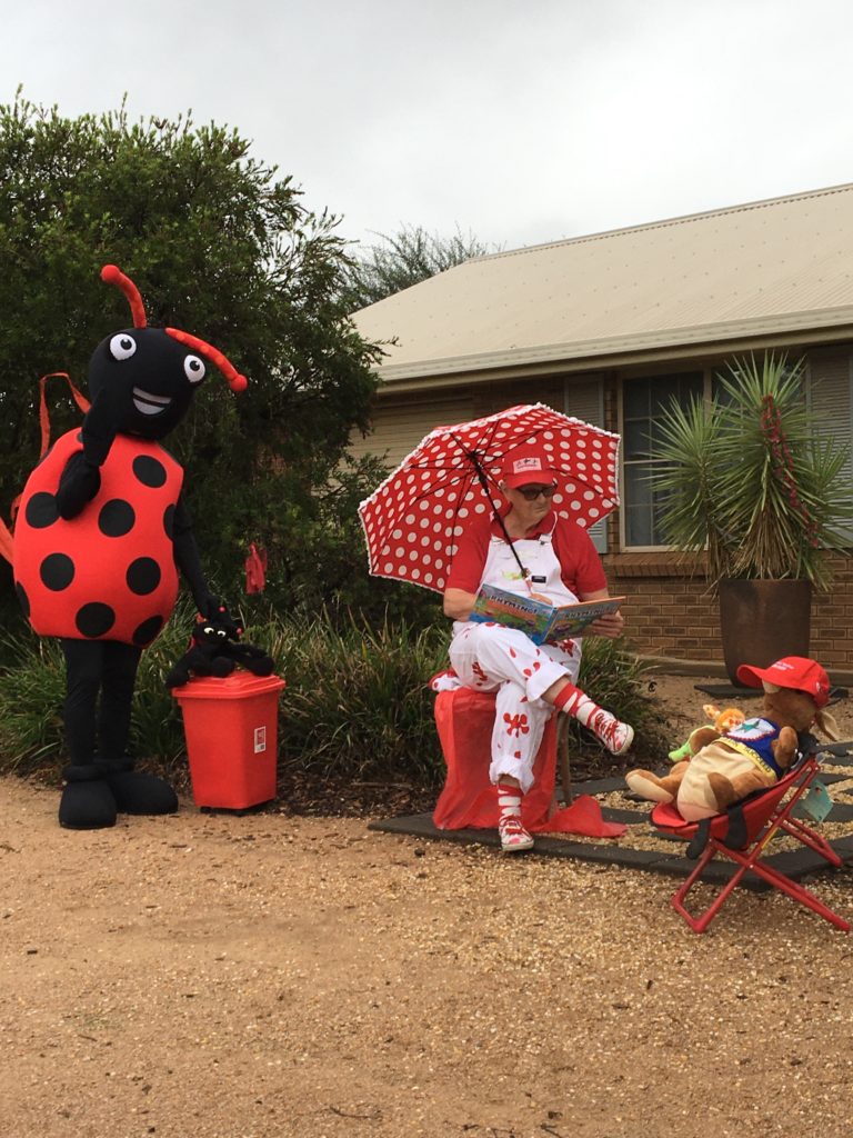 Rhonda Brain with Reading Bug and Apprentice Joey reading at home